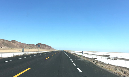 highway crosses salt flats in the Upper Gulf of California