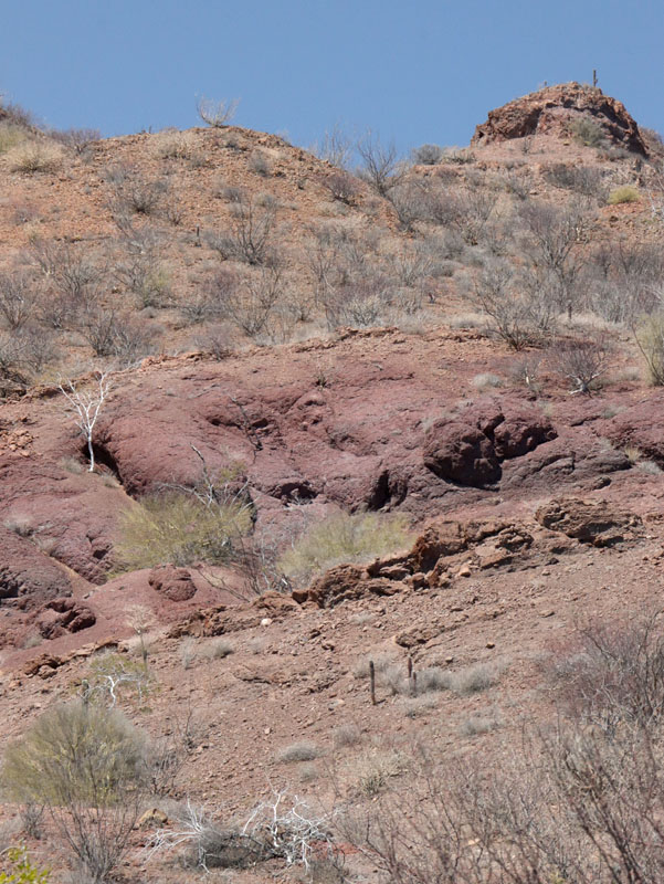 Rocky hillside behind beach